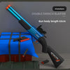 A blue and black double drench blaster rifle with an orange barrel is shown next to a blue box.
