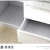 A white kitchen cabinet with a glass shelf showing a gray patterned surface, labeled as high temperature resistance and easy 
