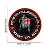 An embroidered patch featuring a shield with a cross and a sword, surrounded by text that reads Put on the full armor of God 
