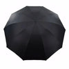 A black oversized folding umbrella viewed from above.