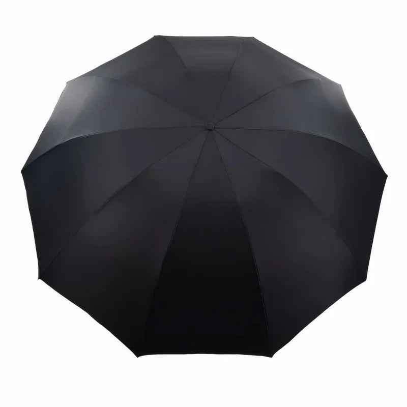 A black oversized folding umbrella viewed from above.