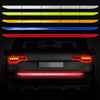 A row of colored reflective safety tapes displayed horizontally against a dark background.