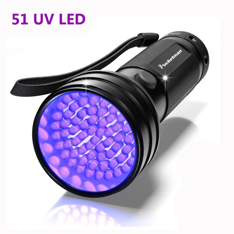 A black handheld UV LED flashlight with a purple light emitted, used for pet stain detection.