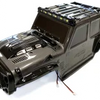 A black high-speed 1/16 4WD RC car receiver parts kit with various electronic components.