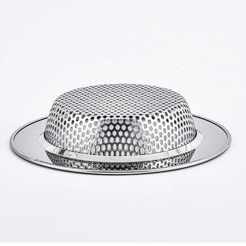A silver stainless steel sink drain strainer with a perforated mesh and a matching plate.