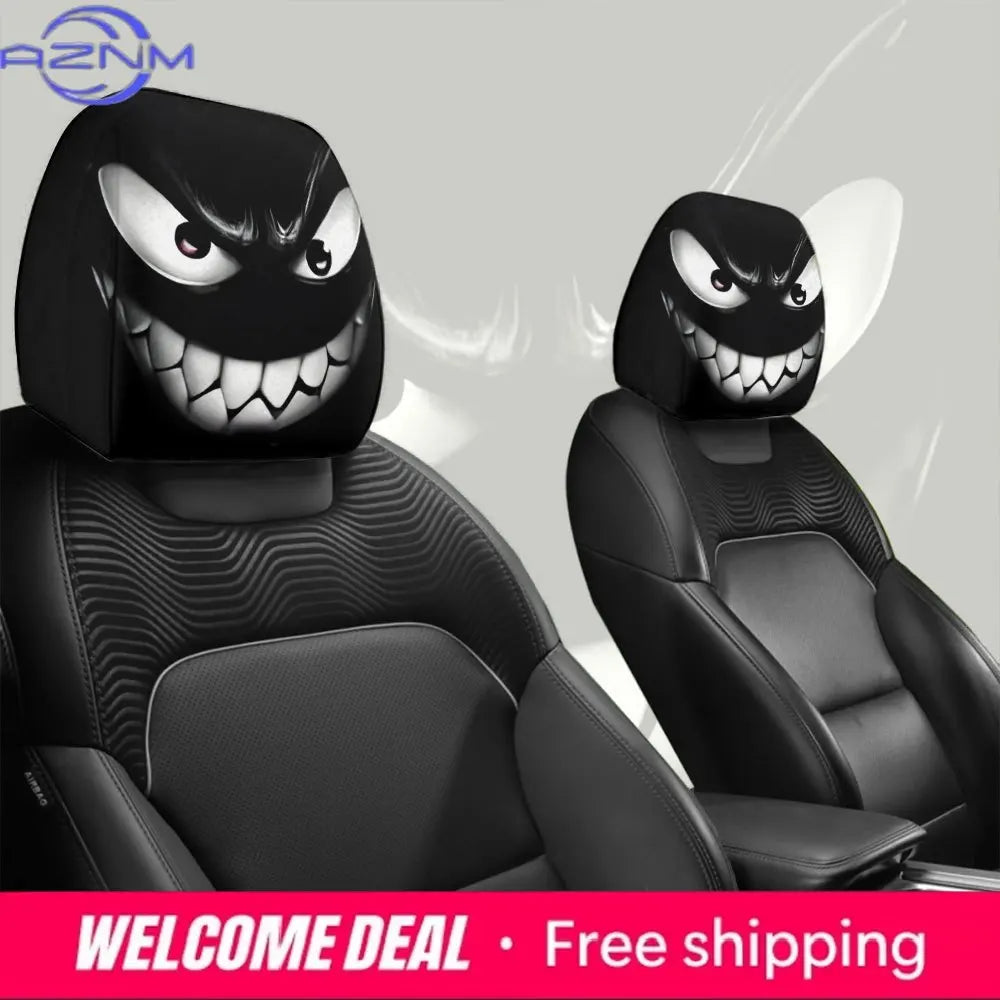 A pair of black car headrest covers featuring a menacing evil grin design.