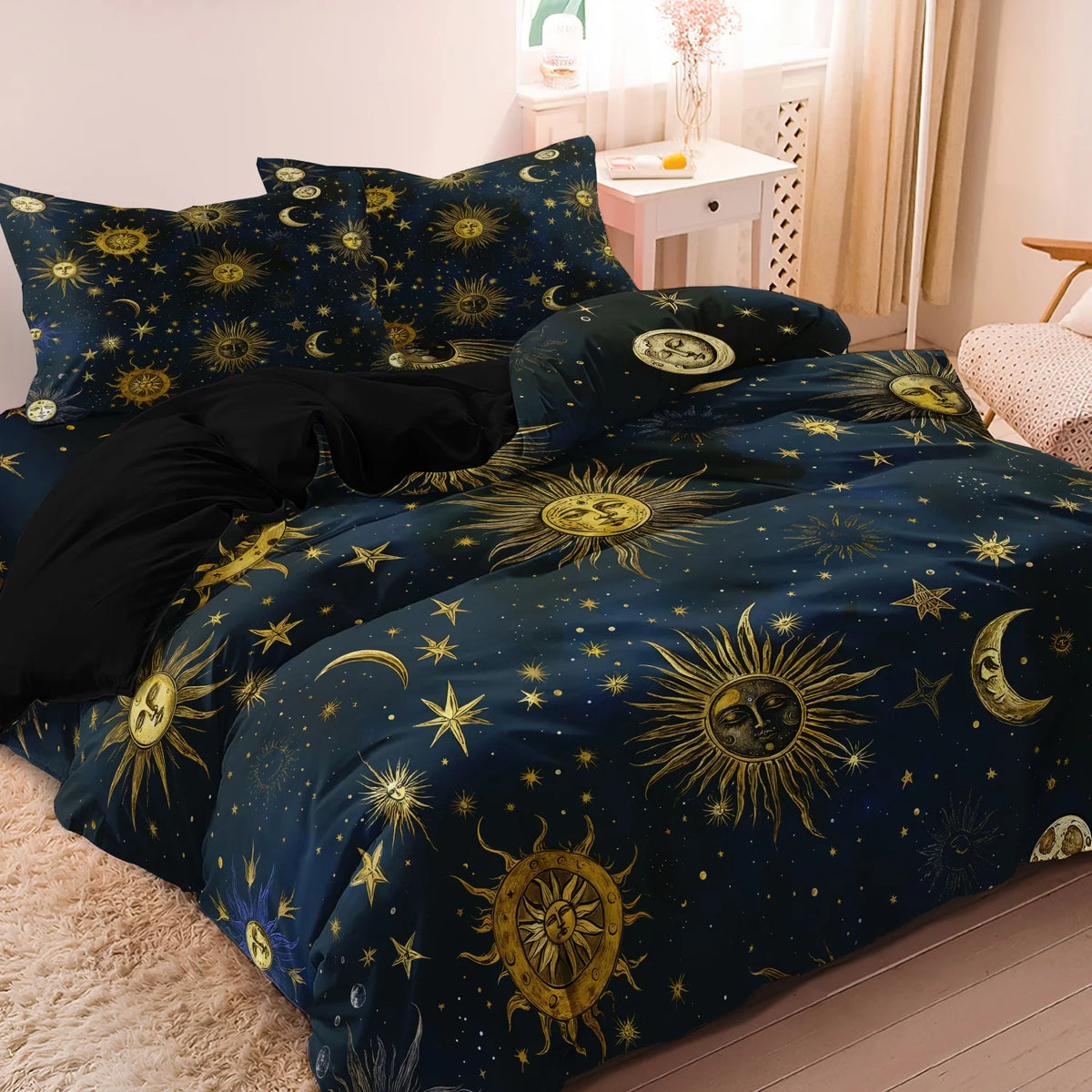 Dark blue duvet cover set featuring a celestial design of suns, moons, and stars.