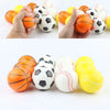 A set of three soft foam sports stress balls in orange, white, and yellow colors.