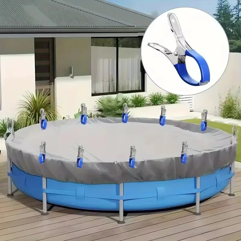 A circular pool cover is secured with stainless steel clips featuring comfort grip handles on a wooden deck.