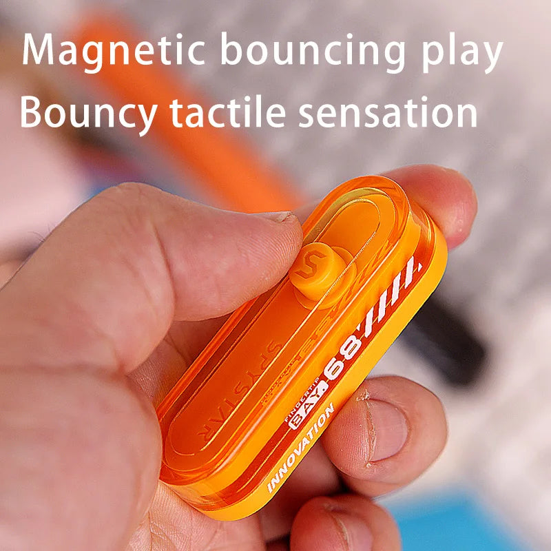 A hand holds an orange magnetic bouncing play toy with a tactile sensation.