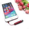 A white tablet displaying an app interface is shown next to a red stylus pen and a bouquet of pink roses.