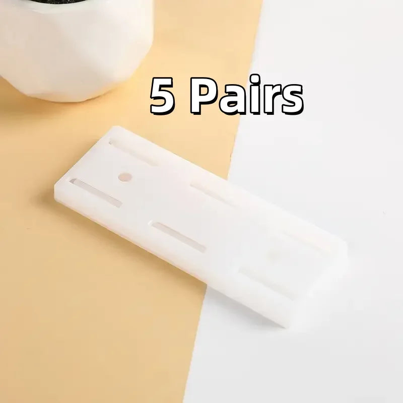 A white adhesive cable organizer is shown on a light beige surface with text indicating 5 pairs.