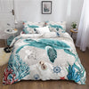 A sea turtle patterned duvet cover set featuring teal and white marine life designs on a bed.