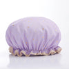 A lavender reusable elastic shower cap with gold star embroidery.
