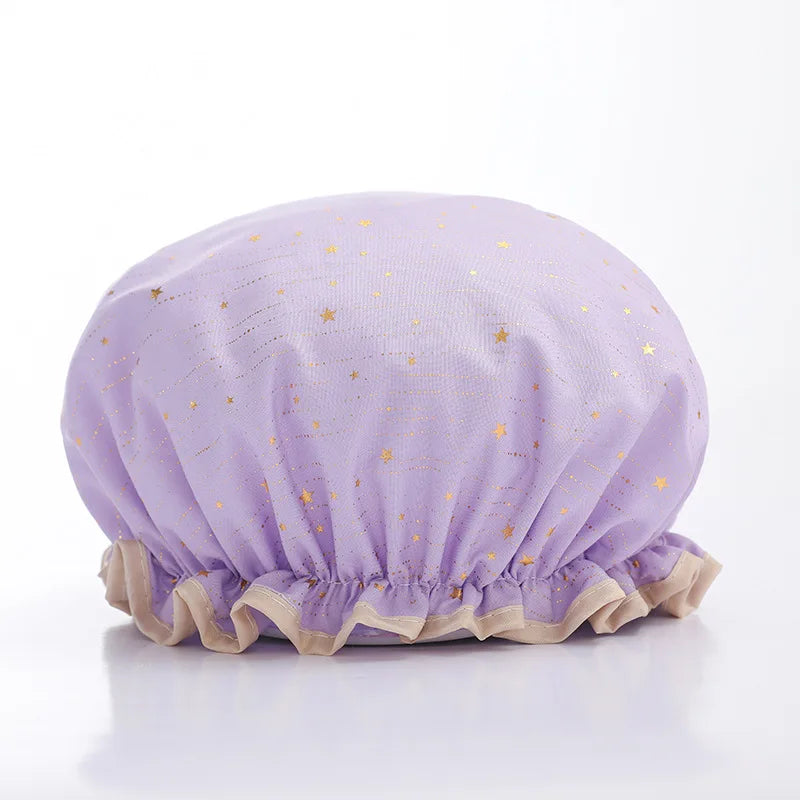 A lavender reusable elastic shower cap with gold star embroidery.