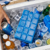 Blue gel ice blocks stacked in a clear ice cube tray inside a cooler with various bottles and cans.