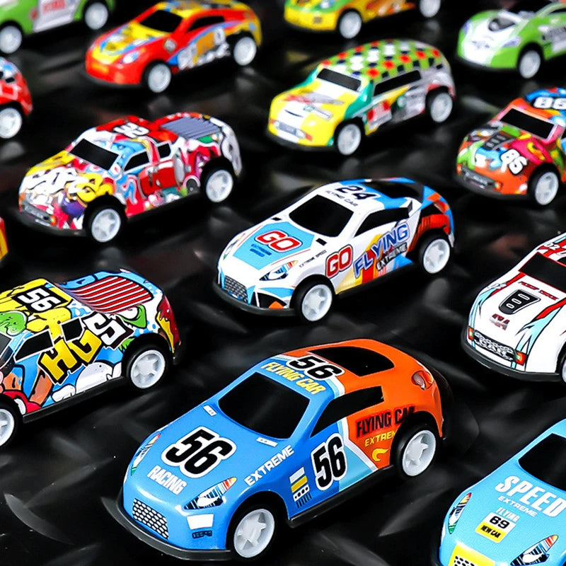 A collection of colorful mini pull-back toy cars, including red, yellow, and orange models, displayed on a dark surface.