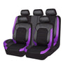 A set of four black PU leather car seat covers with purple accents shown from above.