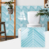 Blue and white herringbone marble peel-and-stick wall tiles covering a bathroom or powder room wall.