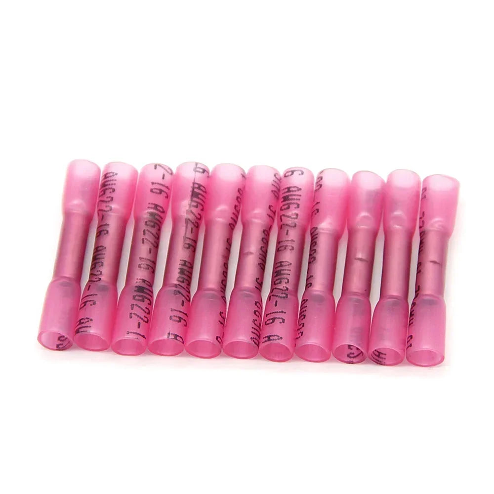A row of pink insulated waterproof heat shrink butt connectors for 22-16 AWG wires.