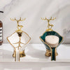 Gold-rimmed leaf-shaped ceramic soap dish with a deer drain rack