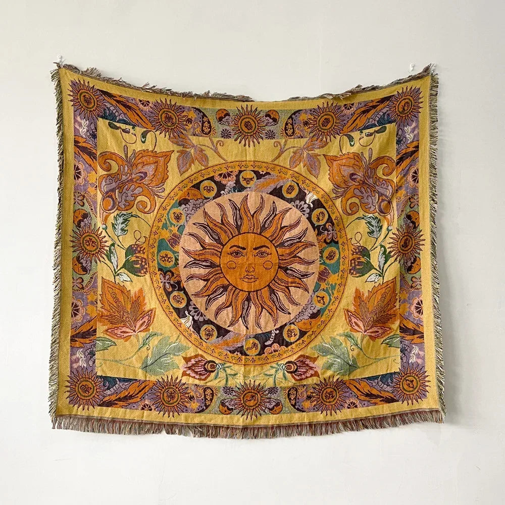 A richly colored bohemian jacquard woven throw blanket featuring a central sun motif and floral patterns.