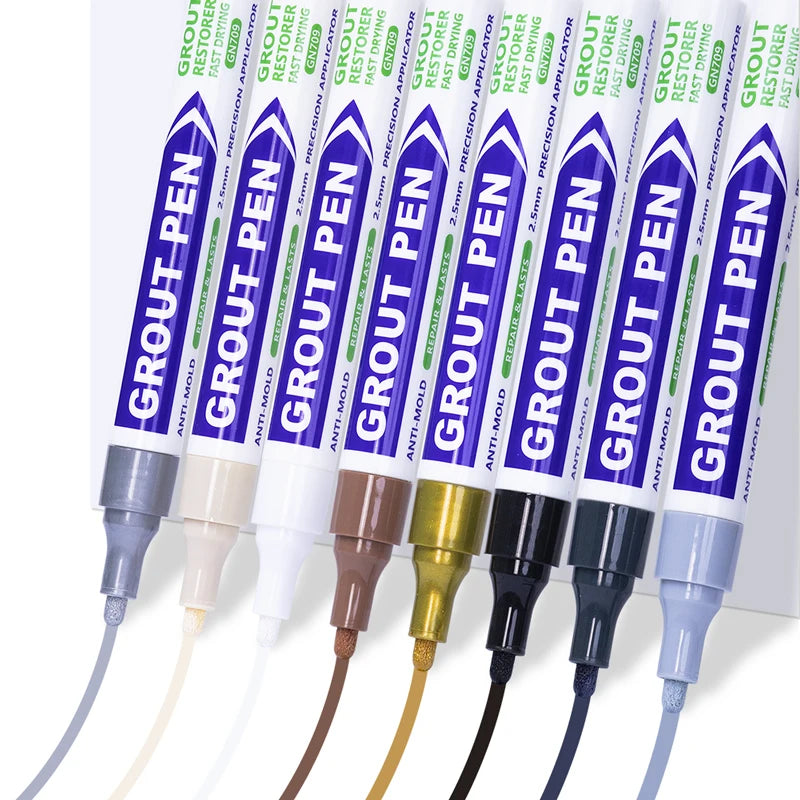 A collection of various colored grout pens with tips and tubes for bathroom and floor touch-ups