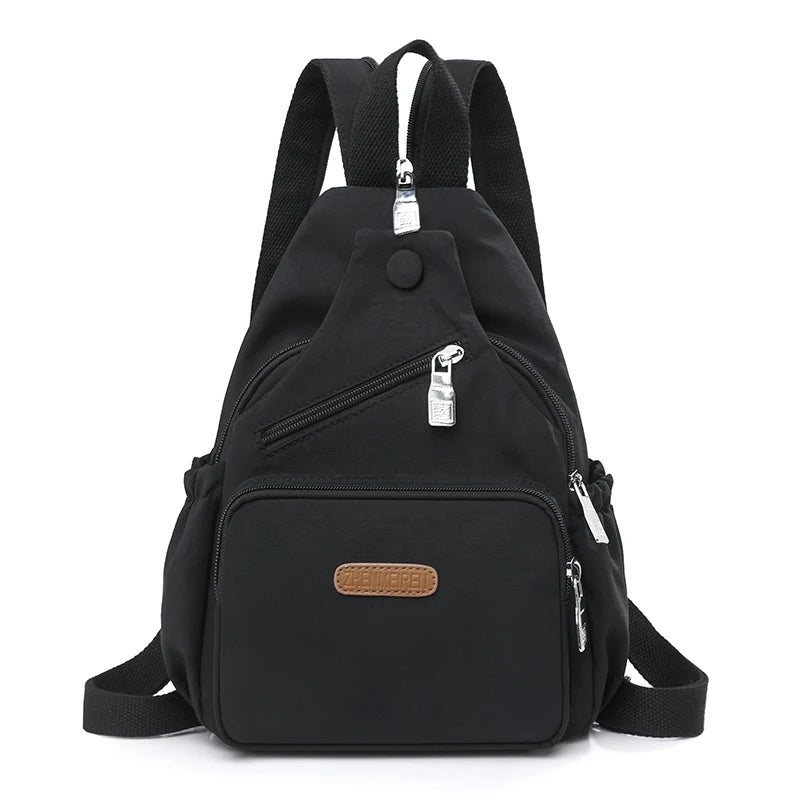 Black waterproof nylon crossbody sling bag for women with adjustable straps and pockets