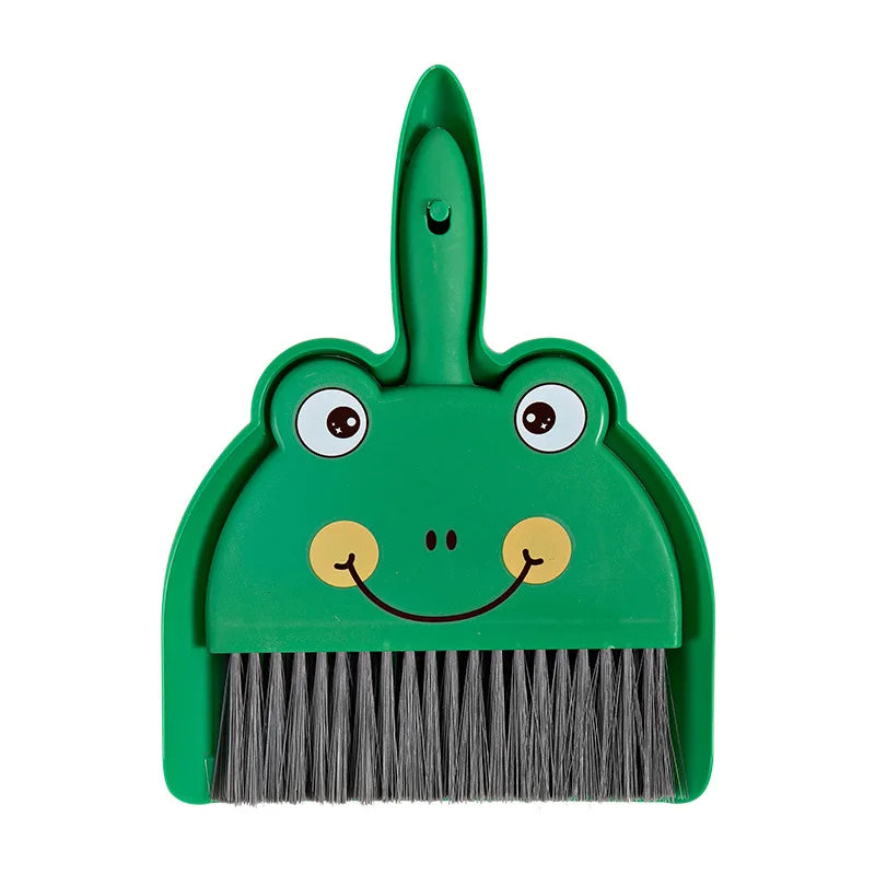 A green cartoon broom and dustpan set with a handle shaped like a frog and bristles.