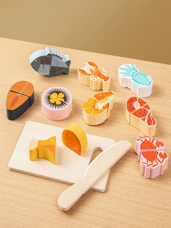 A set of wooden pretend play cutting fruit and vegetable toys in various colors and shapes on a light wooden surface.