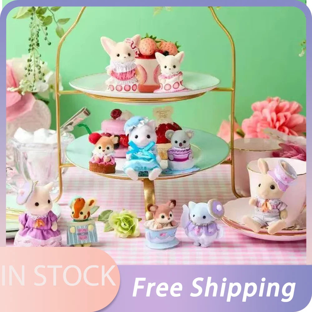 A collection of Sylvanian Families tea party baby figures in various outfits and colors displayed on a gold-framed stand.