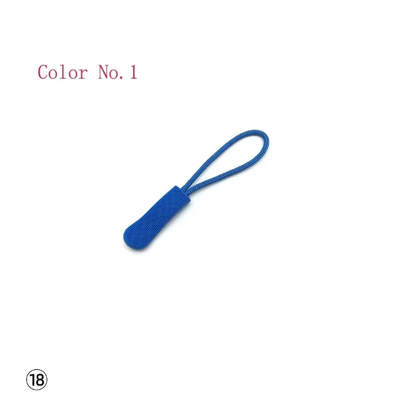 A blue plastic zipper pull with a thin string attached, labeled Color No. 1.