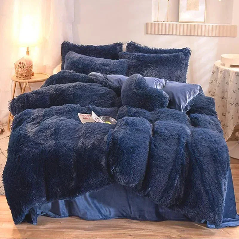 A dark blue plush mink velvet duvet cover set displayed on a bed with white and gray decor.