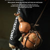 A person holds a handcrafted ceramic gourd wine set with a net bag, featuring an antique style.