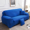 A vibrant royal blue silky soft stretchable sofa cover displayed on a modern couch.