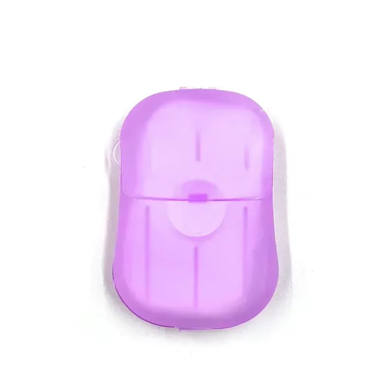 A single purple portable disposable soap tablet for travel.