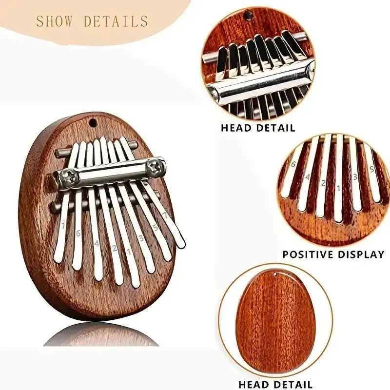 Close-up view of a wooden kalimba thumb piano showing the head detail and metal tines.