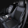 A black leather car seat cushion is shown inside a vehicle, emphasizing comfort and a smooth ride.