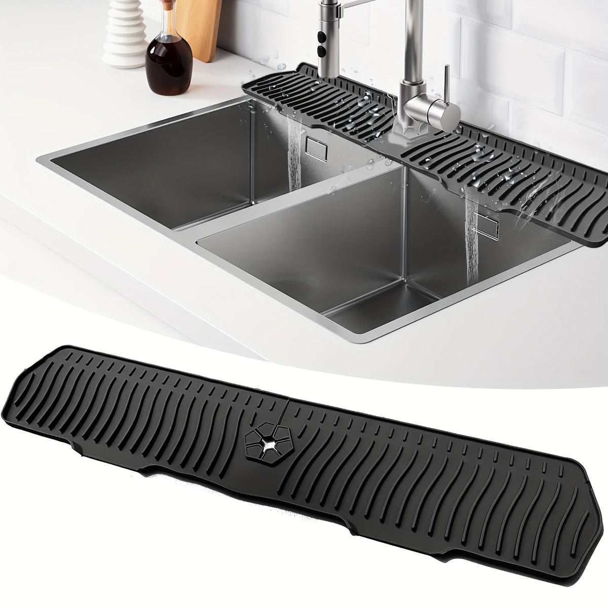 A black silicone faucet mat with a self-draining tray is shown installed in a kitchen sink.