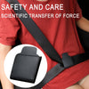 A close-up of a black PU leather seat belt adjuster clip attached to a red shirt.