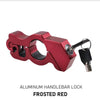 A close-up view of a aluminum handlebar lock in frosted red color with a key and lock mechanism.