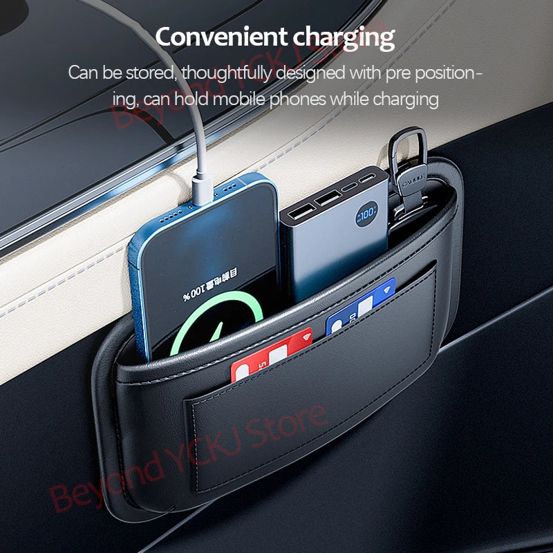 A black leather organizer bag with a side pocket designed for convenient mobile phone charging and storage in a car.