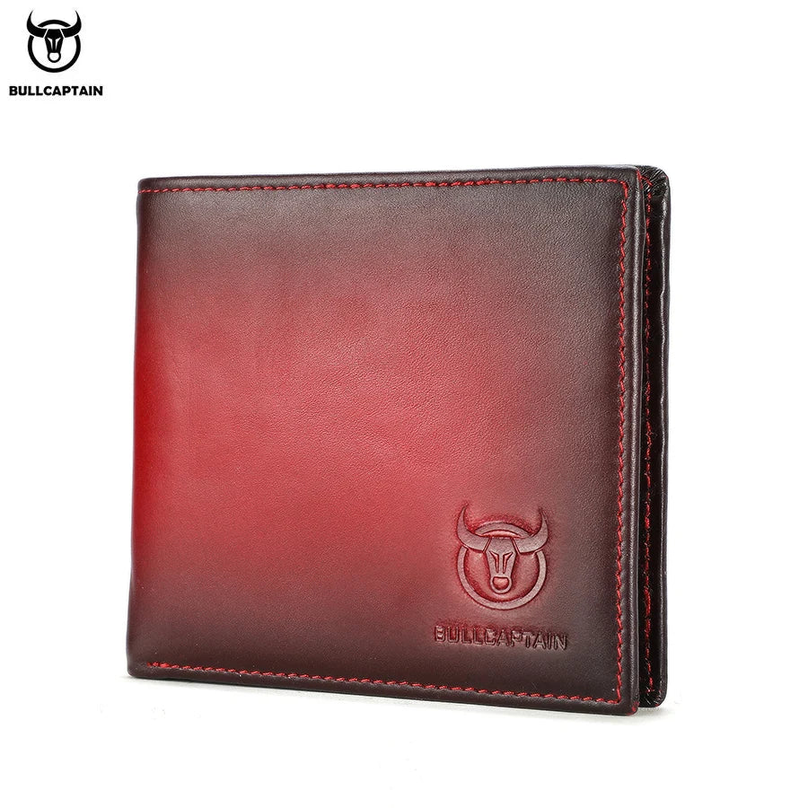 A genuine leather bifold wallet in a deep red color with a embossed bull head design.