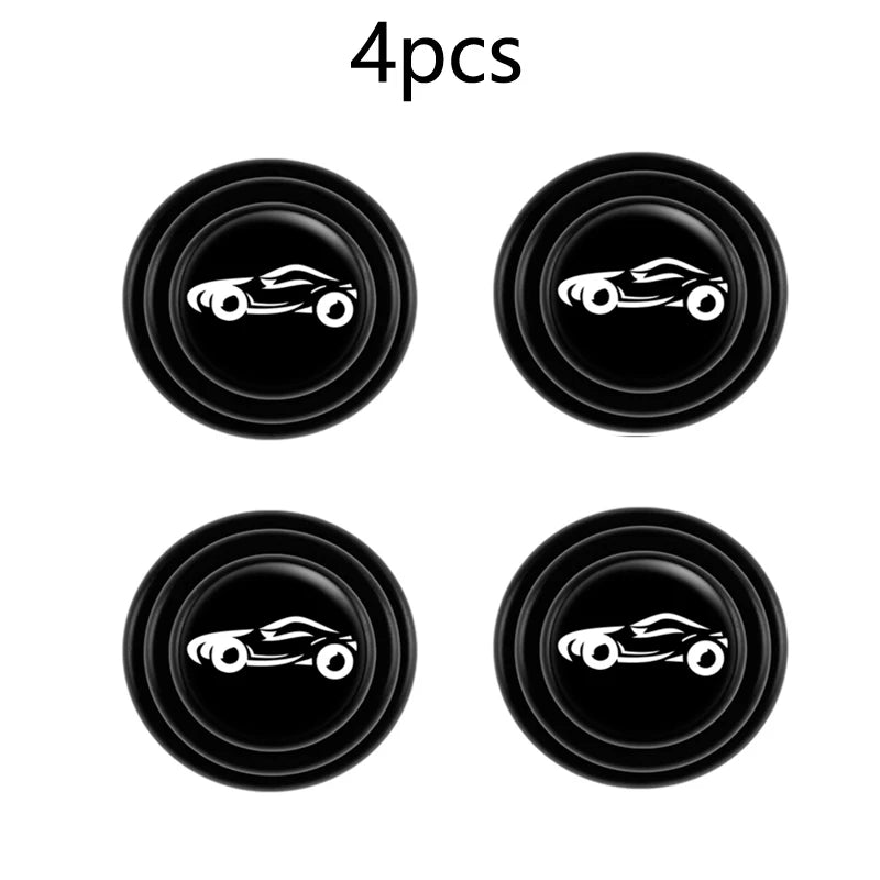 Set of four black car trunk sound insulation pads or shock-absorbing door cushions.