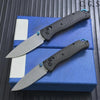 A carbon fiber folding knife with an axis lock is displayed on a blue box.