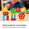 A set of colorful geometric stacking blocks with round edges, including a house shape and various colored pieces.