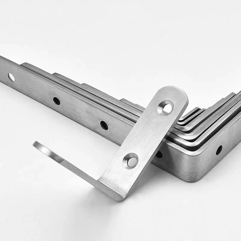 A set of four stainless steel 90-degree angle brackets with screws laid out on a white background.