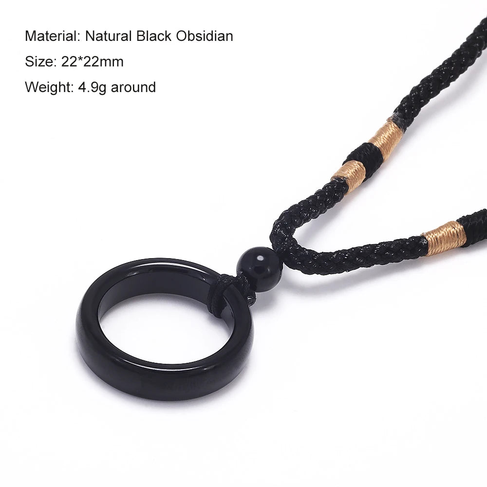 Black obsidian geometric pendant necklace with a black leather cord and gold accents