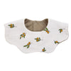 A light beige muslin cotton baby bib or burp cloth with a brown snap closure and small orange-yellow leaves printed on it.