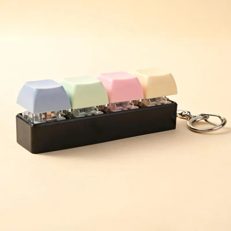 A black LED mechanical keychain fidget toy featuring colorful custom keycaps.